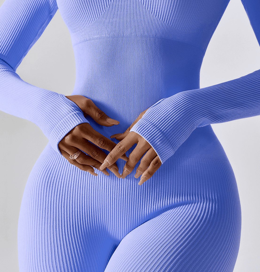 Woman wearing seamless yoga suit with thumb holes on sleeves, perfect for fitness and yoga, showcasing a sleek and flattering fit - SF1287.